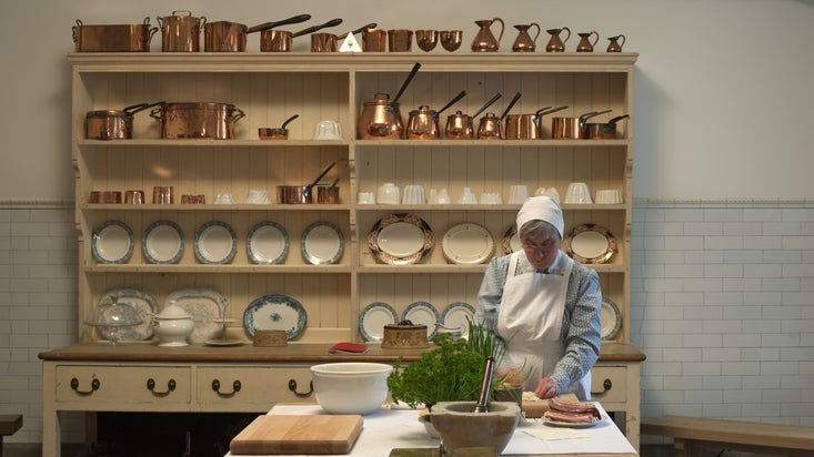 Volunteer costumed interpreter in the Kitchen in the Basement at Ickworth, Suffolk.